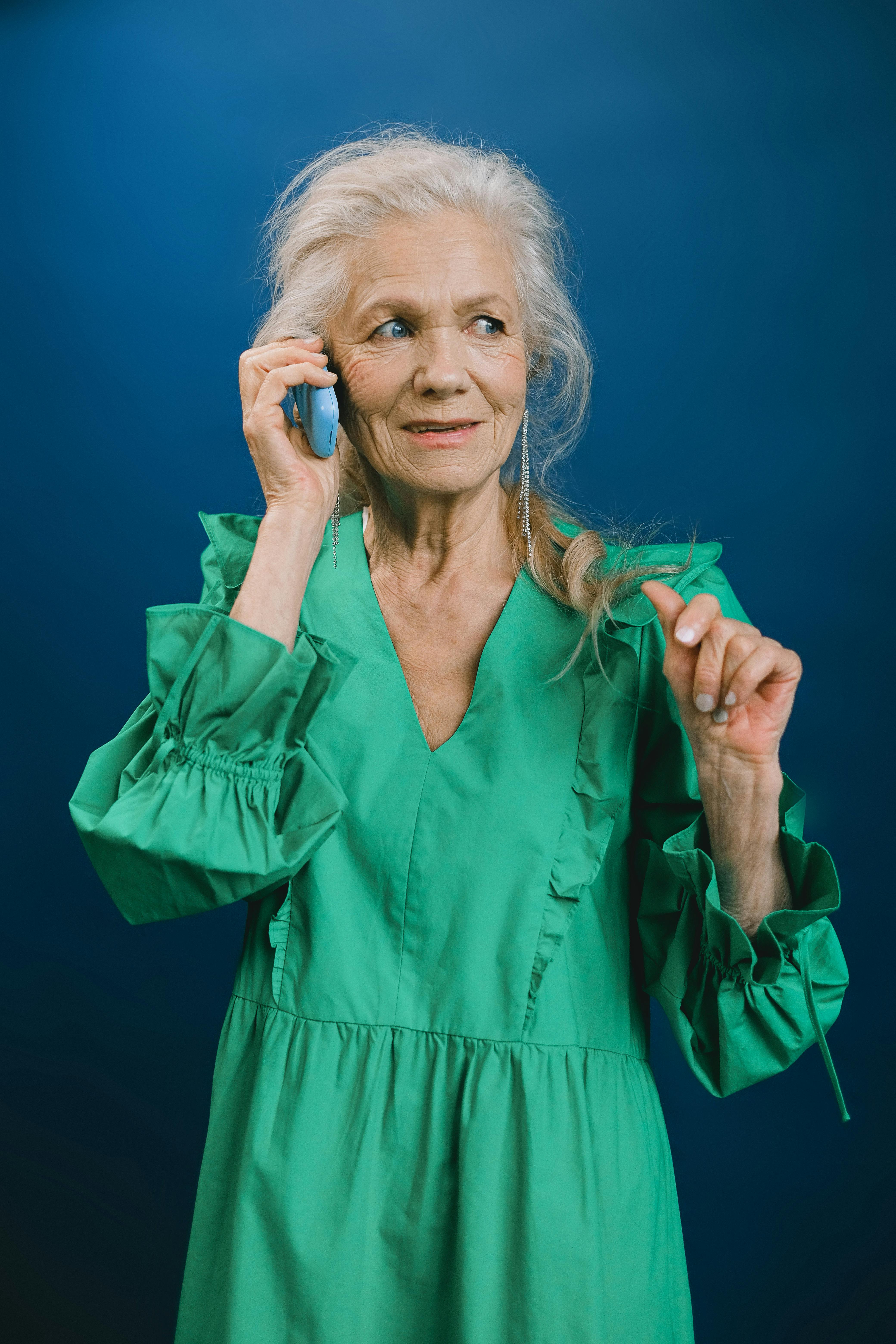 An elderly woman on a phone call | Source: Pexels