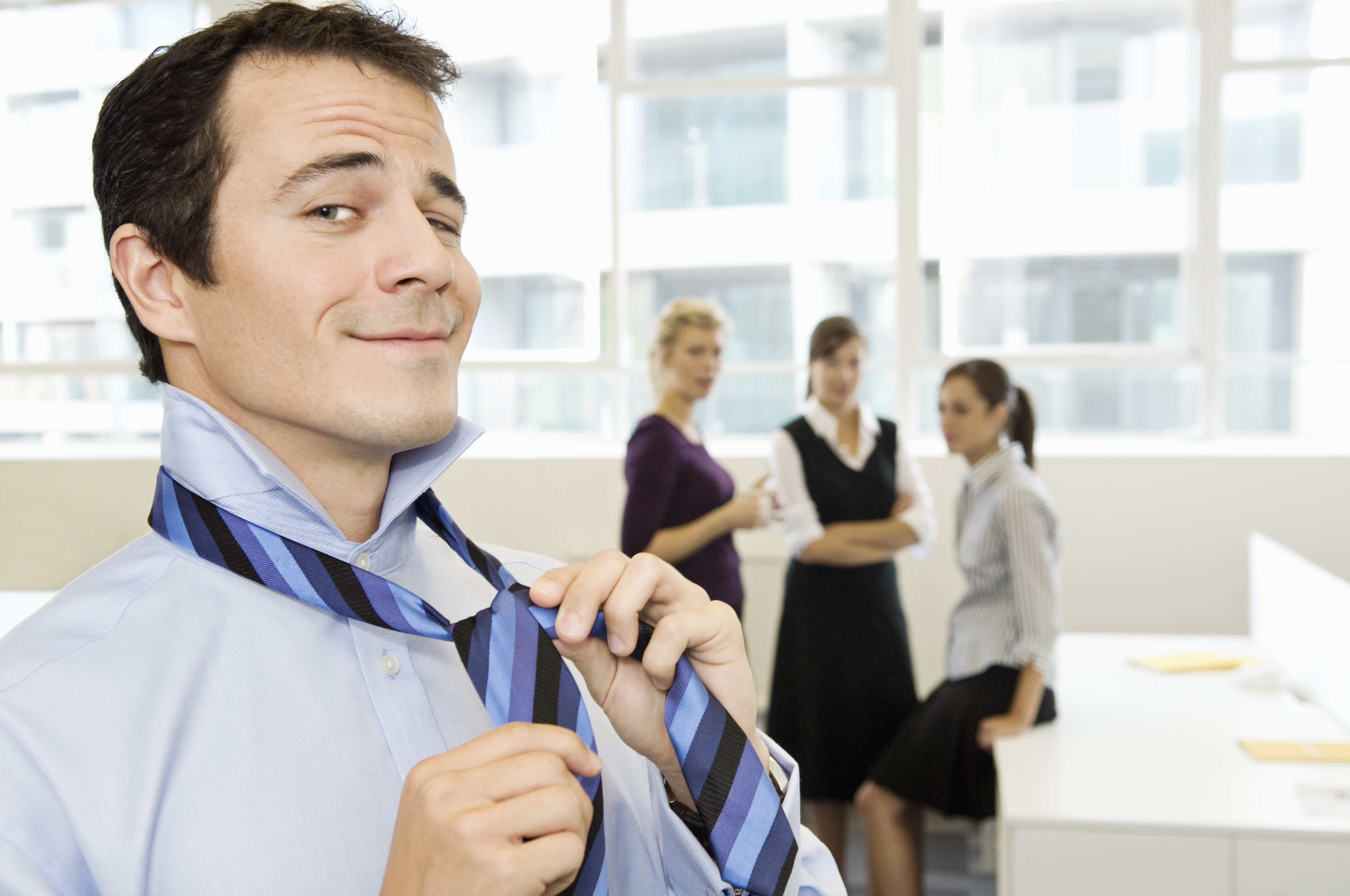 Business man being watched by the girls | Source: Getty Images