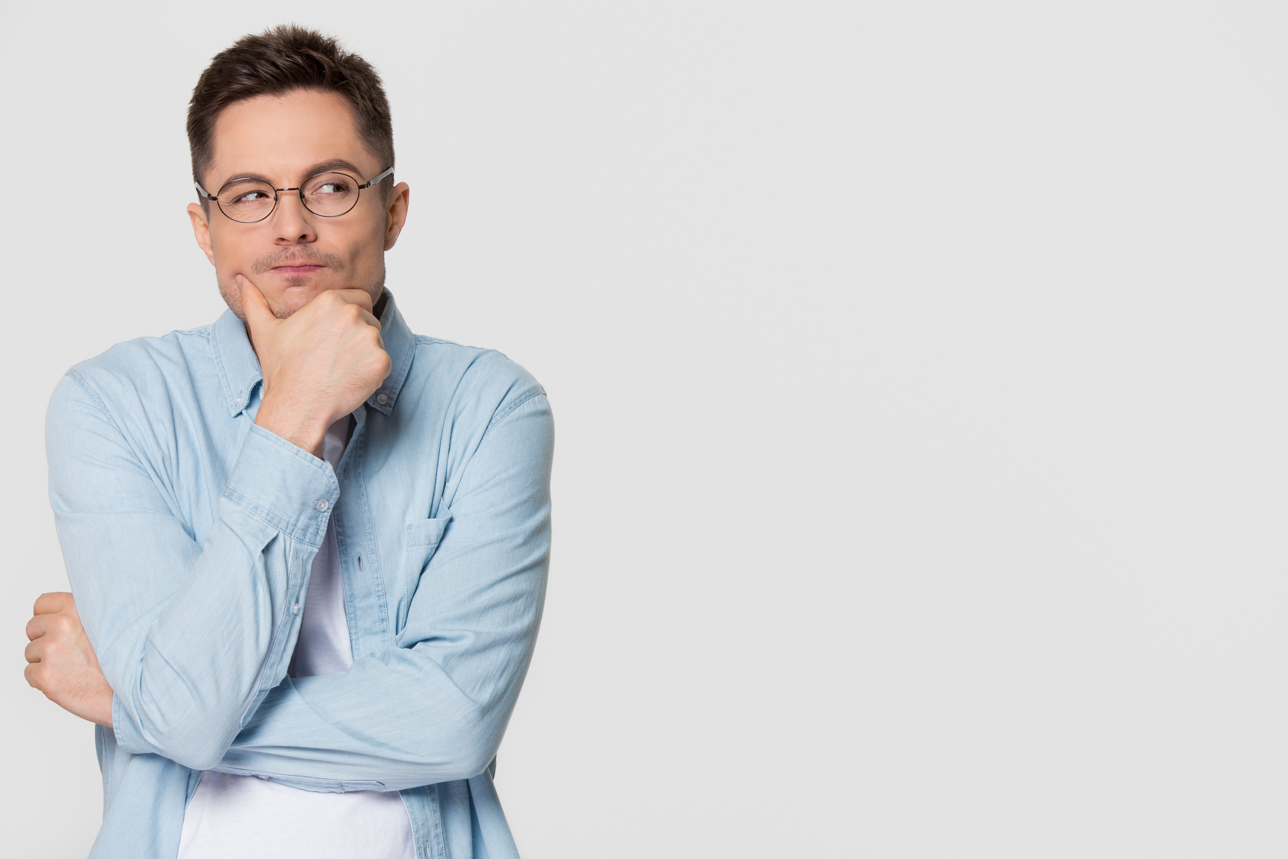 Thoughtful suspicious young man looking aside at copyspace feeling skeptic | Source: Getty Images