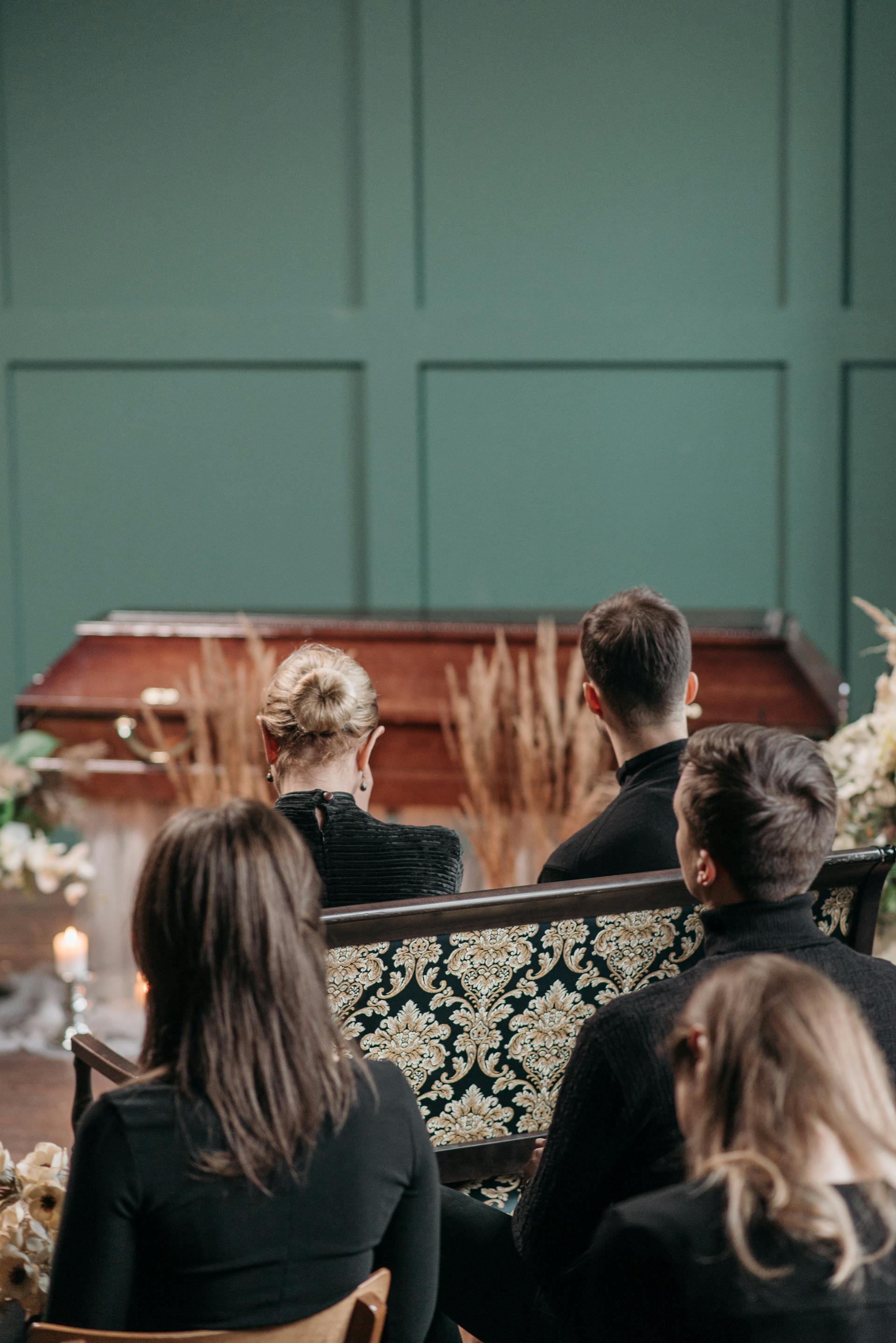 Grieving people attending a funeral service | Source: Pexels