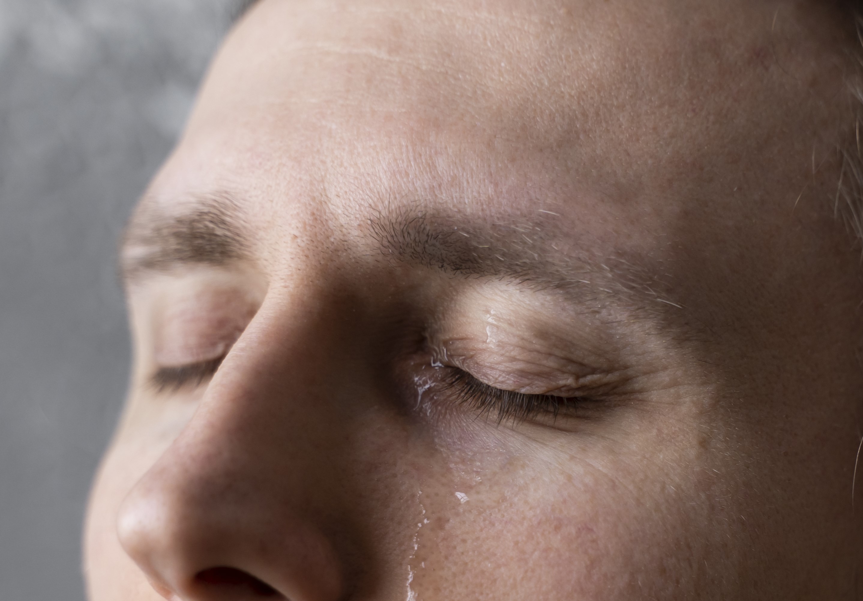 Close-up of a teary-eyed man | Source: Freepik